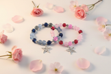 Blue and Pink Star Bracelets Floral Flat Lay