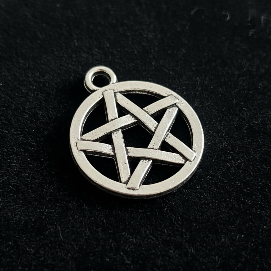 Close up detail of silver pentacle pendant