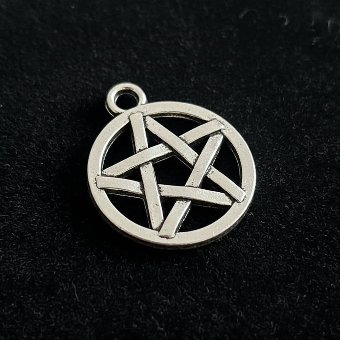 Close up detail of silver pentacle pendant