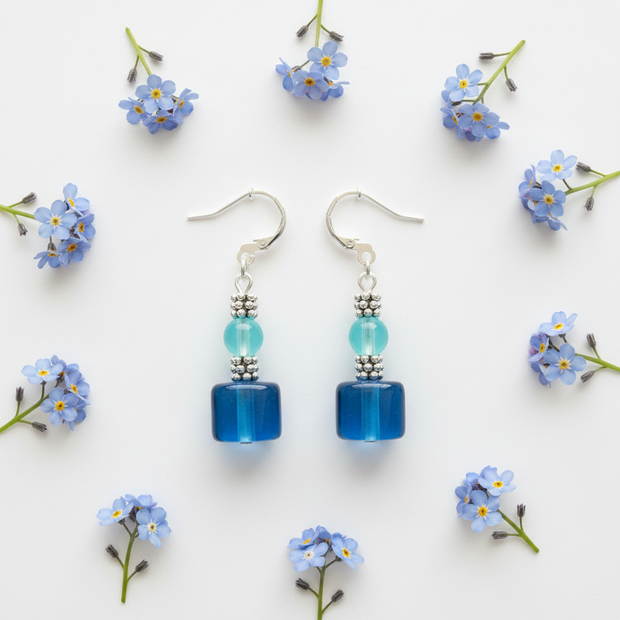 Flat lay with blue flowers