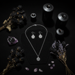 Gothic flat lay of pentacle jewellery set