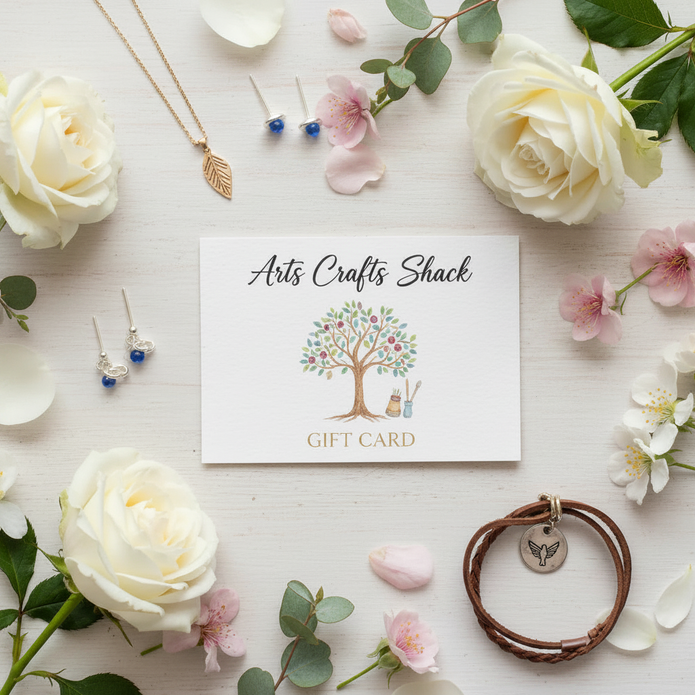 Arts Crafts Shack gift card flat lay with white roses and pink blossom flowers