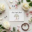 Arts Crafts Shack gift card flat lay with white roses and pink blossom flowers