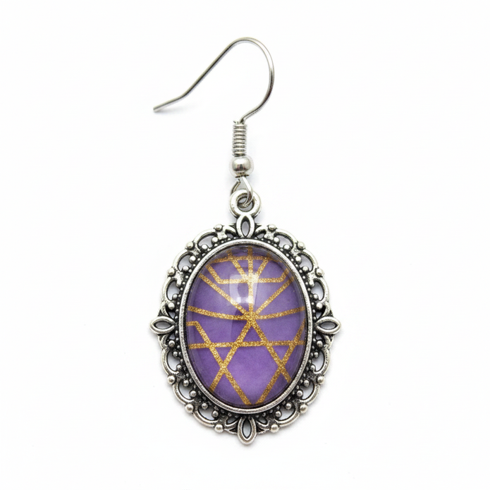 Gothic purple glass earring close-up detail shot
