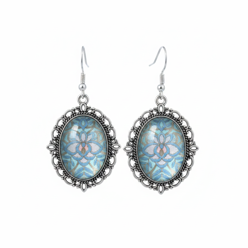 Iridescent blue holographic cabochon drop earrings on white background studio shot