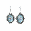 Iridescent blue holographic cabochon drop earrings on white background studio shot