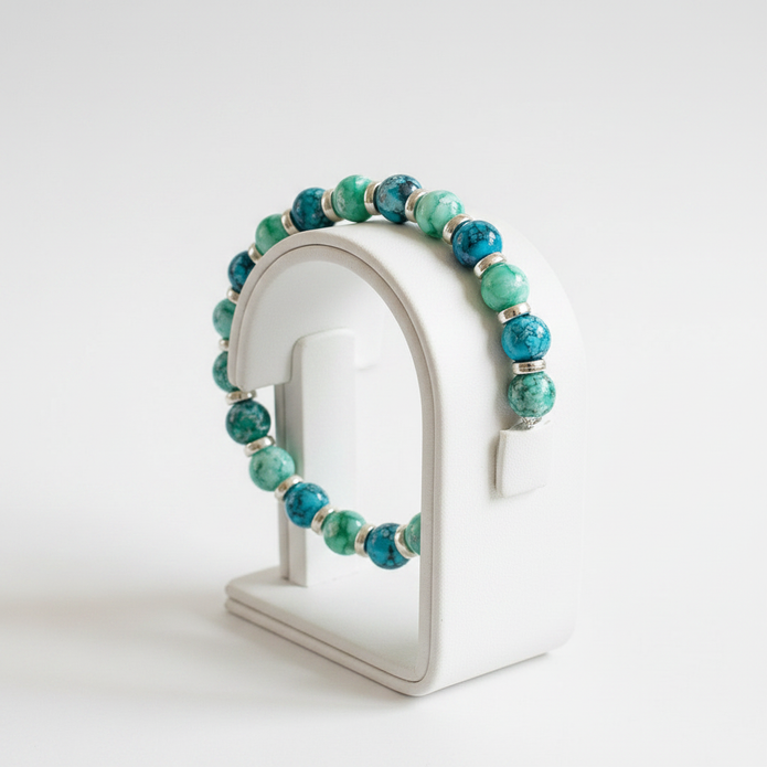 Turquoise and green beaded bracelet on a jewellery display stand