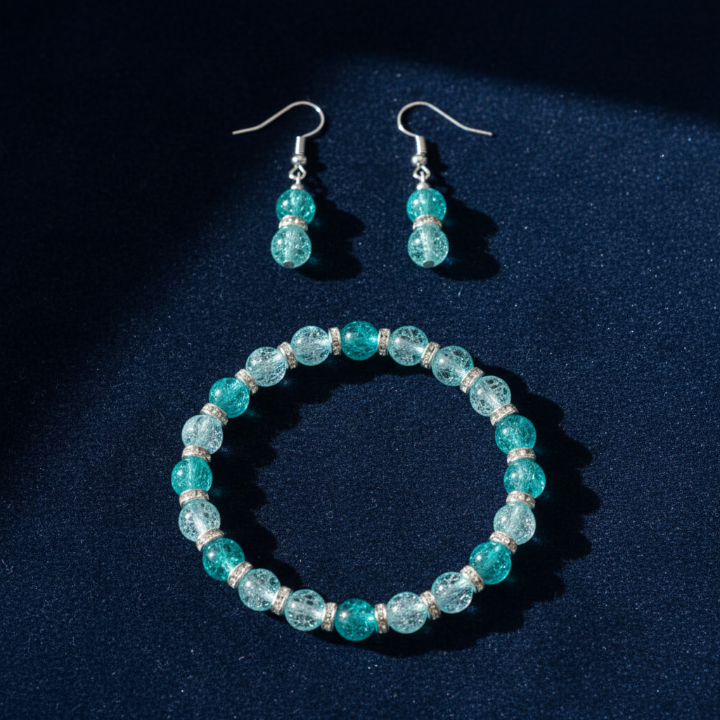 Teal aqua crackle glass bead bracelet and earrings set flat lay on dark velvet