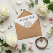 Arts Crafts Shack gift card in a kraft envelope with scattered rose petals