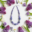 Shades of Purple & Silver Rescued Necklace floral flat lay