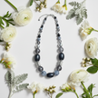 Shades of Black Grey & Silver Rescued Necklace floral flat lay