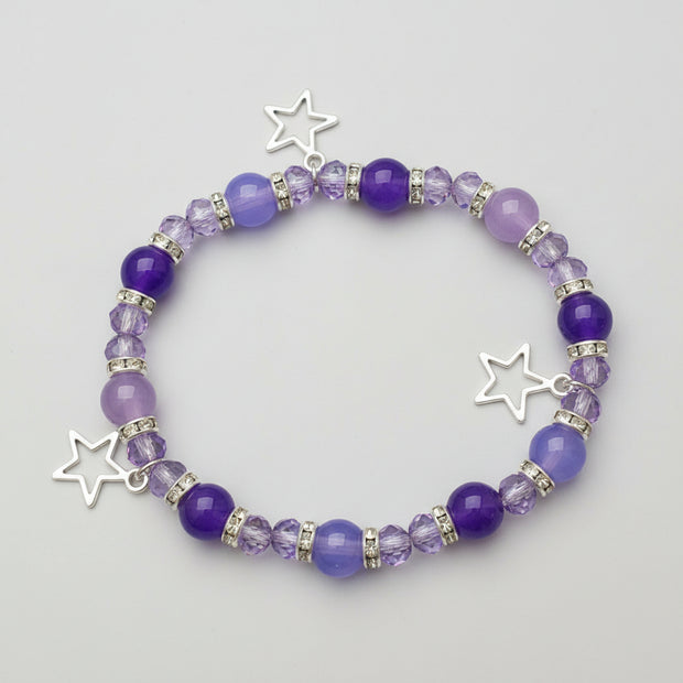 Purple beaded bracelet with star charms
