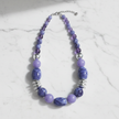 Shades of Purple & Silver Rescued Necklace on marble surface