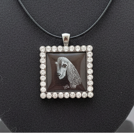 Beautiful dog artwork in a pendant necklace with black cord